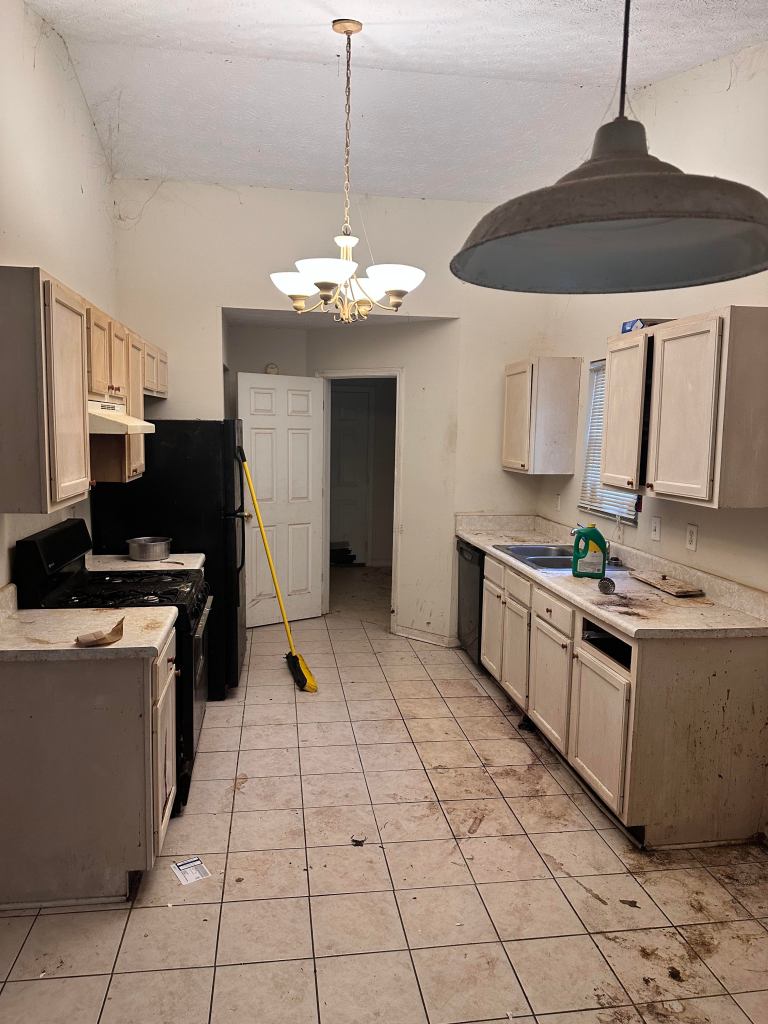 Before kitchen remodel – outdated cabinets and layout in Cumming GA home flip